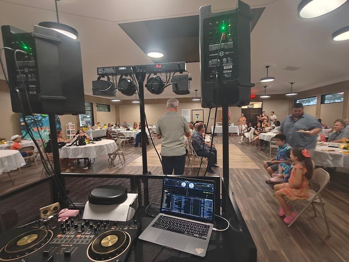 DJRinzler’s DJ setup at an indoor celebration